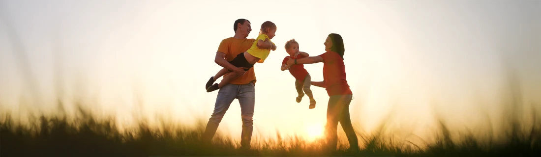 Family Playing With Two Young Children